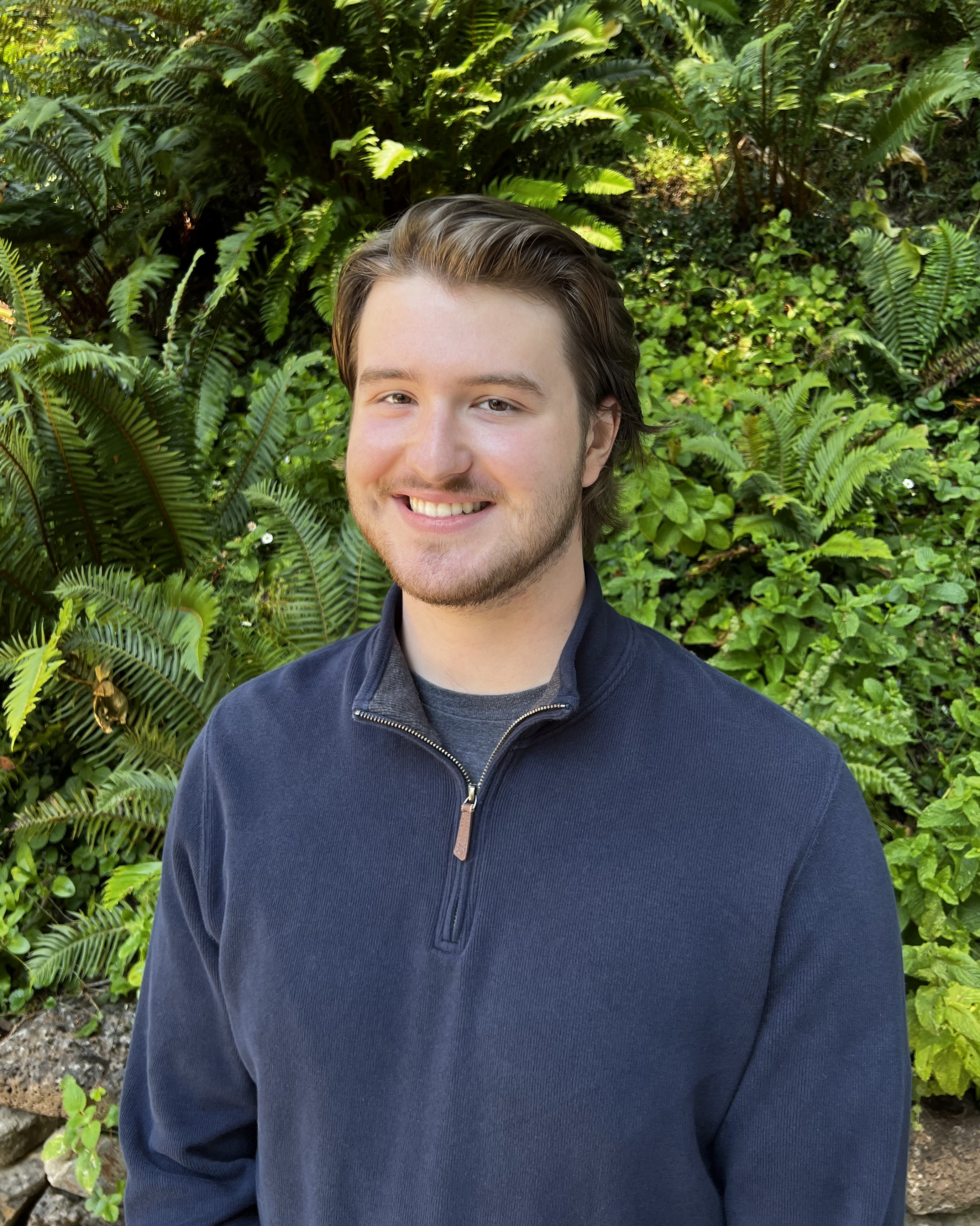 Eli smiles at the camera.