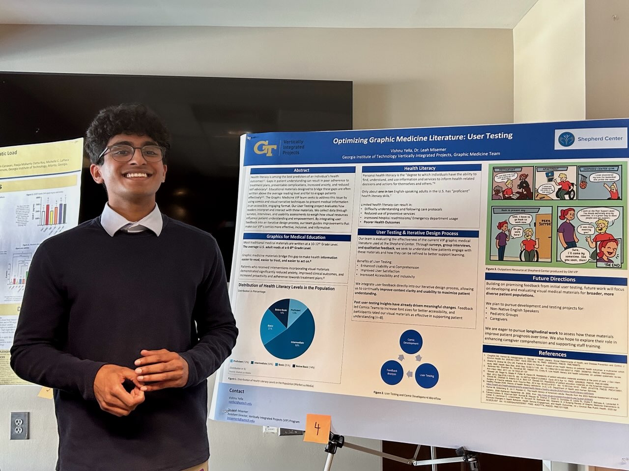 Vishnu stands by a poster about his research.