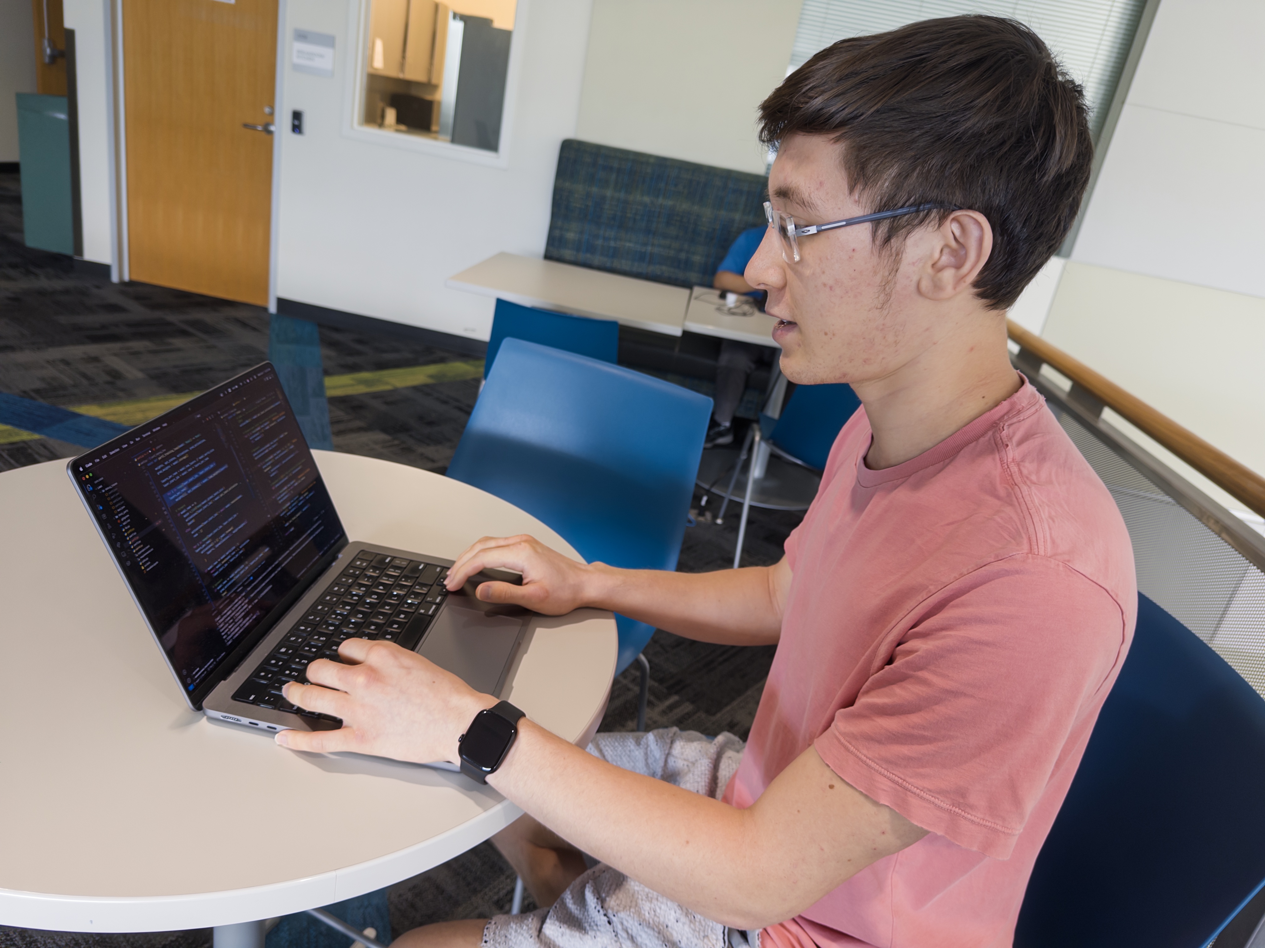David works on his laptop.